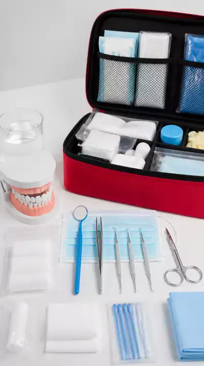 Emergency dental care kit with dental tools and tooth model