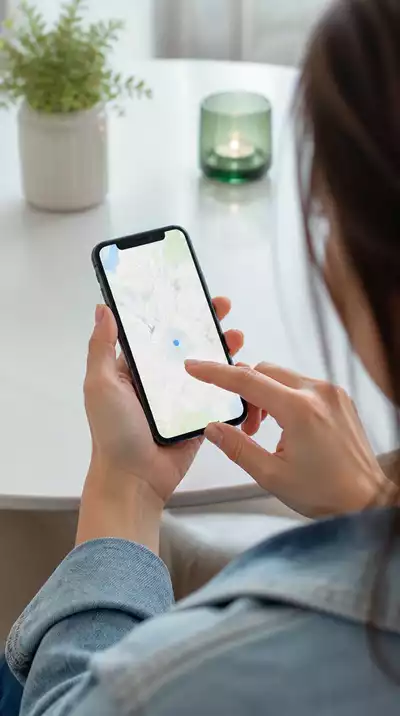 Person using a smartphone to search for 'emergency dentist near me'